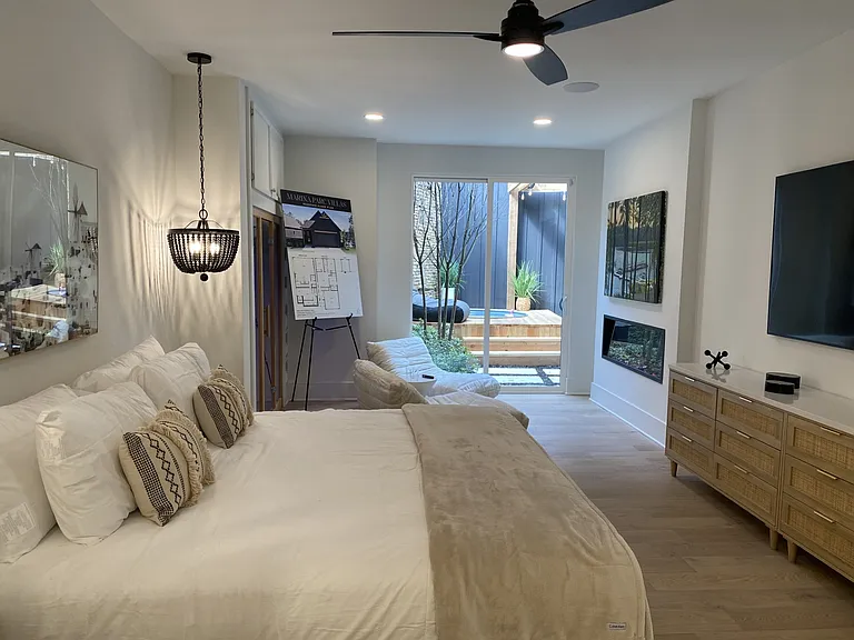 Main bedroom with walk out to soak-er tub, full screen TV in bedroom