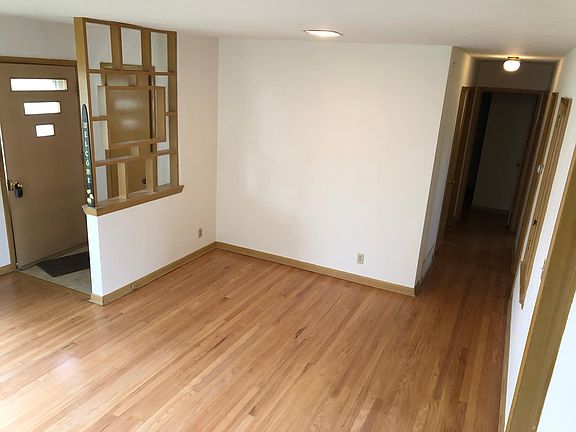 Living room looking toward the bedroom hallway.