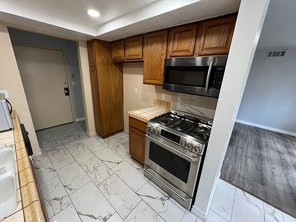 Kitchen with stoveTop and microwave oven