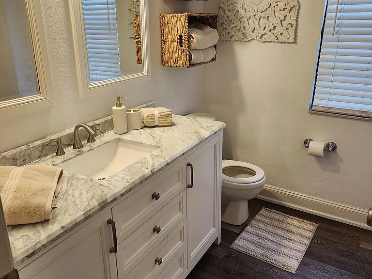 2nd full size bathroom with tub/shower. All brand new flooring and vanity.