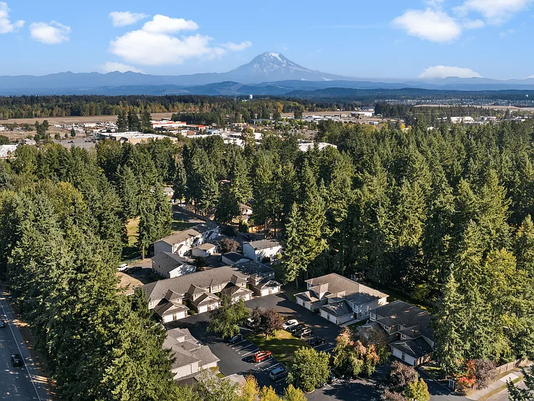 Breathtaking view of Mountain Park Townhomes with Mount Rainier on the horizon.