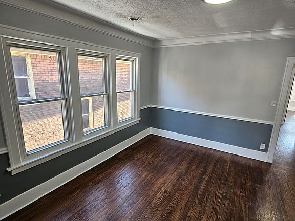 Spacious dining room, two toned paint job and lots of natural light.