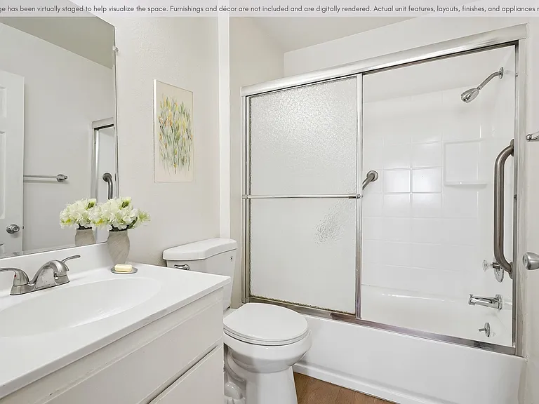 Clean bathroom with a full tub and functional vanity space.