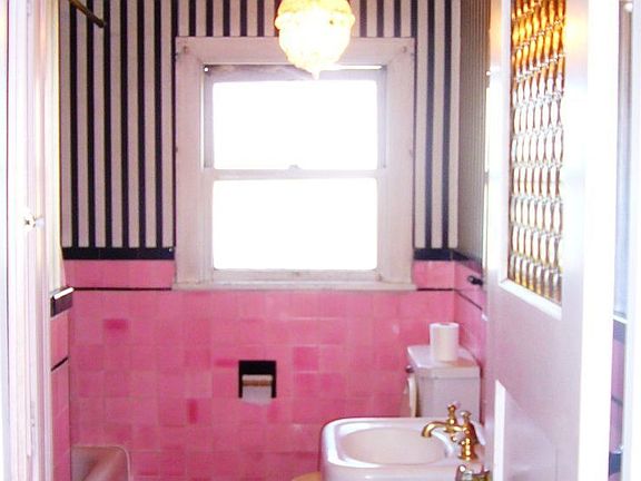 Full bath with pink tiles