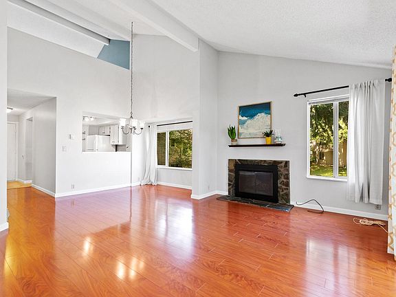 Great room with fireplace and hardwood flooring
