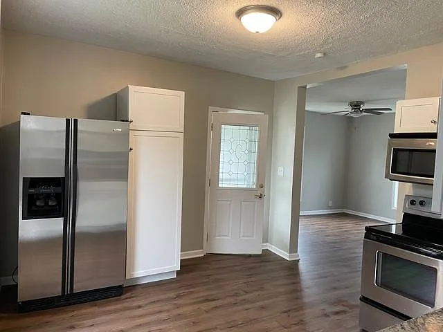 Open first floor with kitchen and living room.