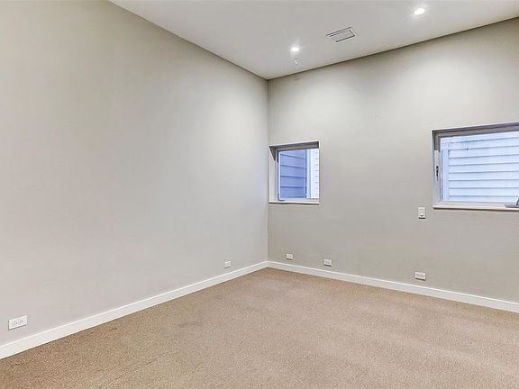 Generously sized secondary bedroom conveniently situated on the second floor alongside the master. Features an ensuite bath and a spacious walk-in closet.