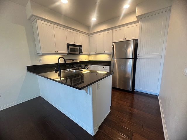 Stainless steel kitchen appliances and granite countertop