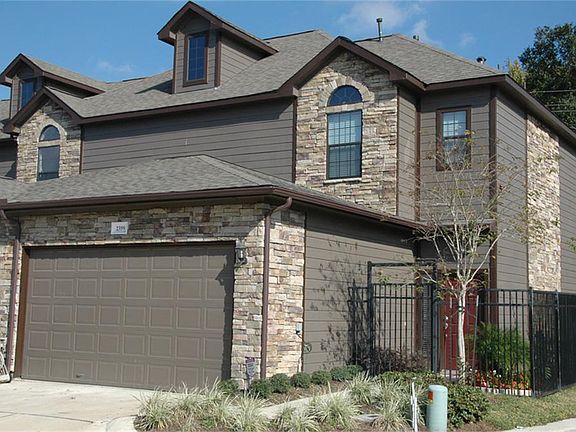 Awesome exterior with stone accents. Gated entrance at front door.