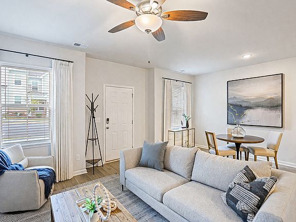 Spacious Living and Dining Rooms with wood-style flooring