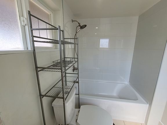 Bathroom rub and shower and fixtures are brand new.