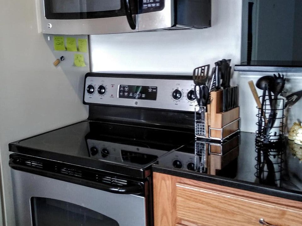 Kitchen area with pass through to Living room