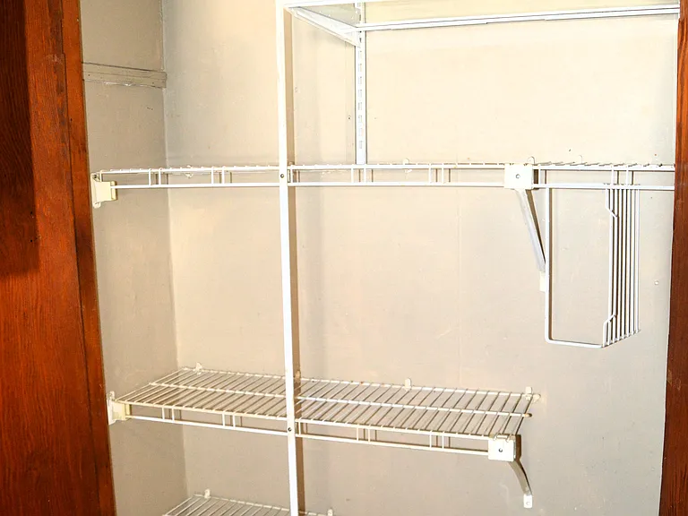 Spacious pantry/broom closet.