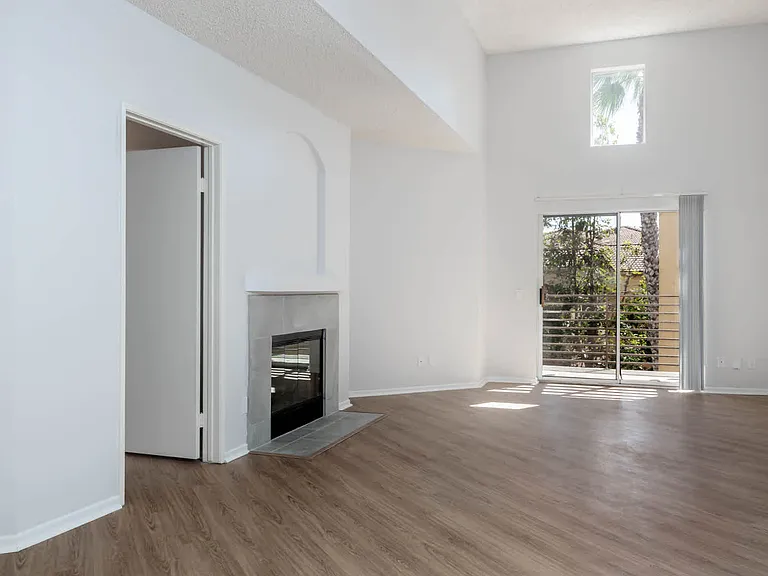 Living Room with Fireplace and Balcony