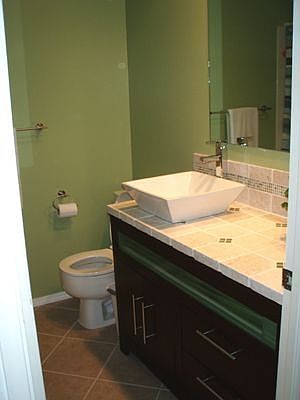 Hall Bathroom. Custom vanity, marble tile counter, modern vessel sink