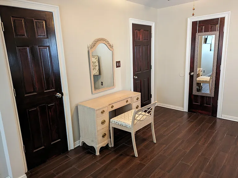 Door on left leads to first floor bathroom. Door on right leads to first floor hallway (staircase, other bedroom, and family room)