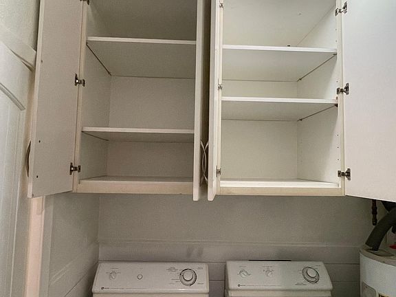 Huge storage cabinets in Laundry room with adjustable shelves