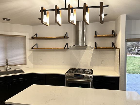 All new kitchen. Cabinets, countertops, paint and backsplash.