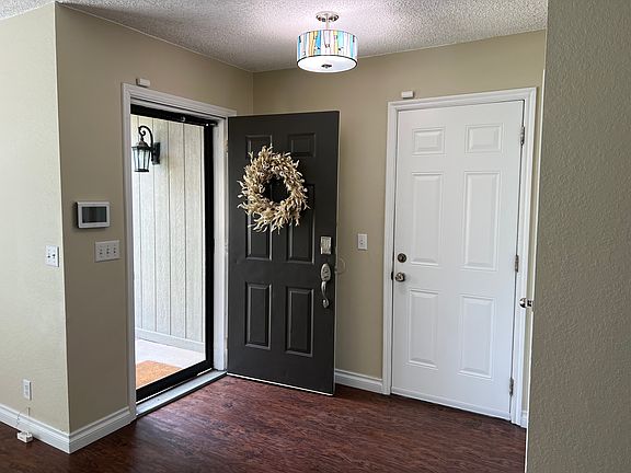 The white door opens to the garage.