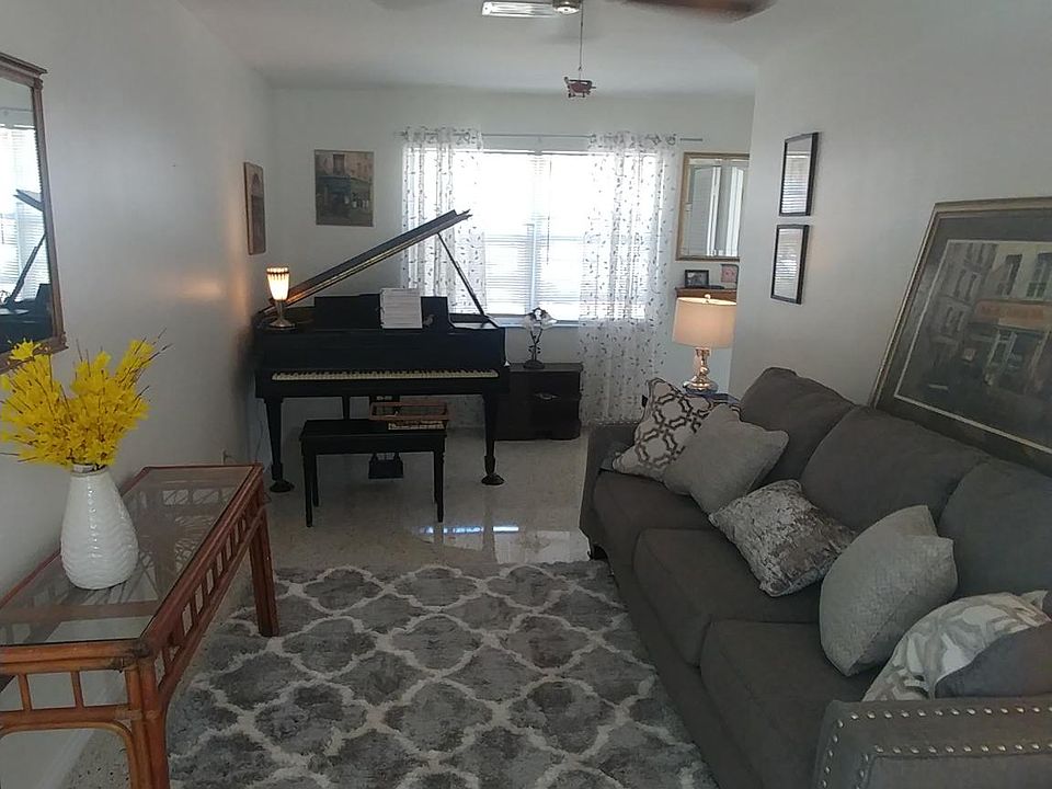 Living room with newly-tuned baby grnad for your playing enjoyment.