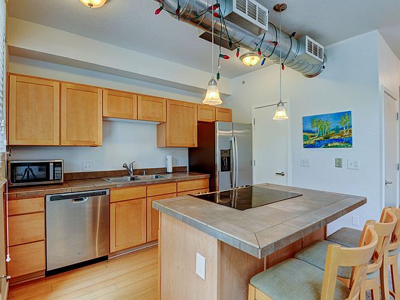 Ample storage pantry next to refrigerator