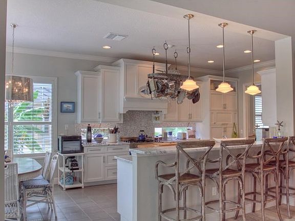Gourmet chef's kitchen with Carrera Marble counters.