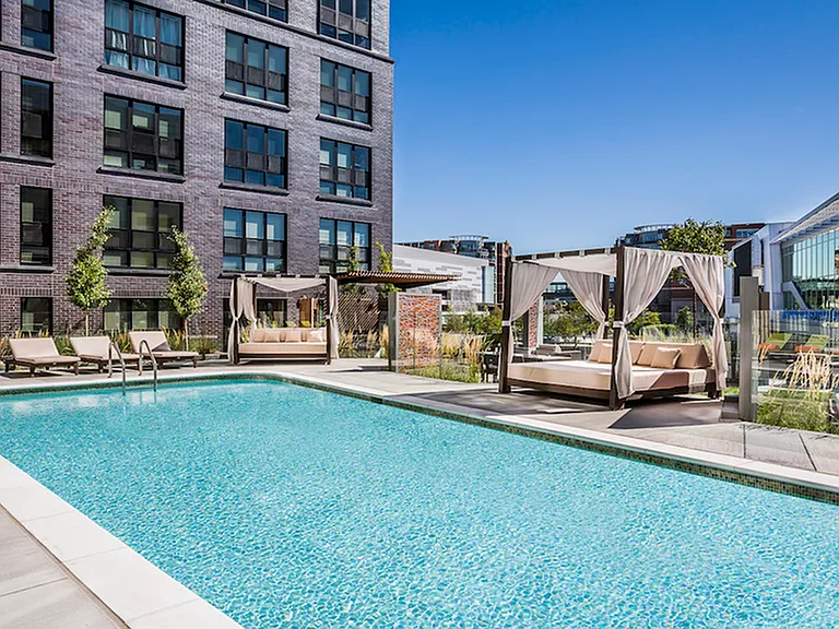 Resort-Inspired Pool Deck with Luxury Cabanas