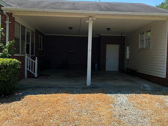 two car carport and back door entrance into back porch