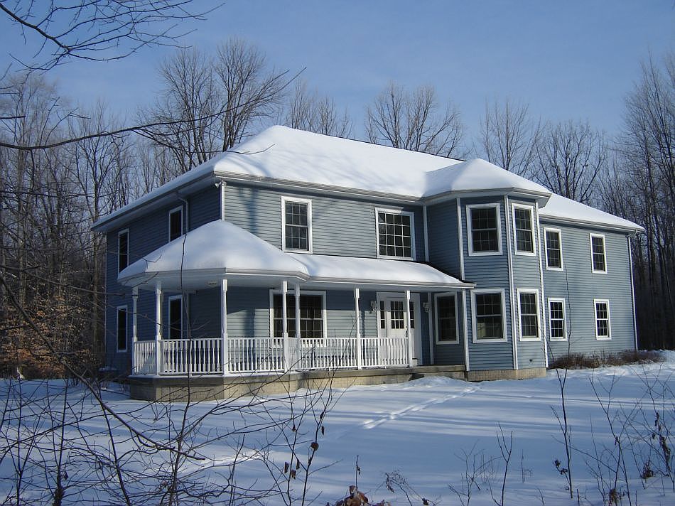 Enter this large country home from a good-sized, private front porch. Enjoy a secluded and sun-filled quiet retreat that has 4 BDR and 4 BTHs, which also has 2 wooded acres and is at the end of a cul-de-sac in Larkin Twp. This custom built home includes a Library, with 16ft of floor-to-ceiling booksheveles, a spacious kitchen with maple cabinets and a sunny dining area, a large main floor laundry room, a 3 car garage, and a large basement workshop, also an additional 650 sq. ft of finished basement space with egress window and a perfect spot for a Media Room. This house features beautiful red oak wood floors and large high efficiency windows. There is a sunny 16x26 Bonus Area over the garage near the huge Master Bedroom and its large Dressing room. 2nd floor has a 2nd BDR with a bath across the hall, and a 3rd BDR with its own private bath. 1st floor includes a stunning foyer with french doors leading to the kitchen and dining room area. Lots of closet space for storage on 2nd floor.