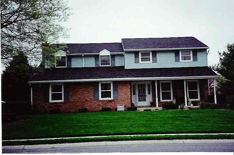 Brick with blue vinyl siding