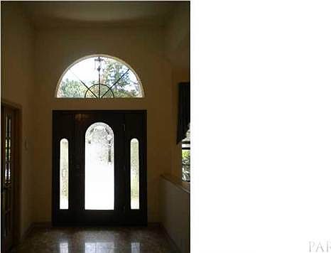 Circle Top Window and Marble Floor in the Gracious Foyer