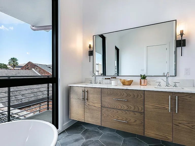 The master bathroom features a double sink vanity and quartz countertops.