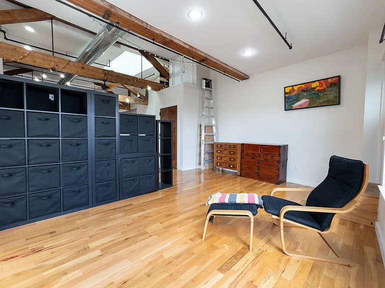 This is usually the bedroom area with east, rising-sun facing windows (not shown behind chair).