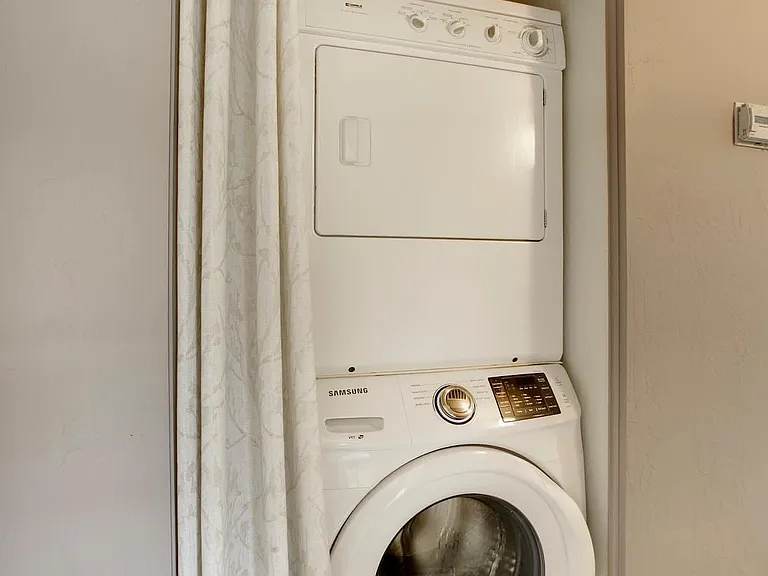 Hallway - Full-size laundry washer and dryer included.