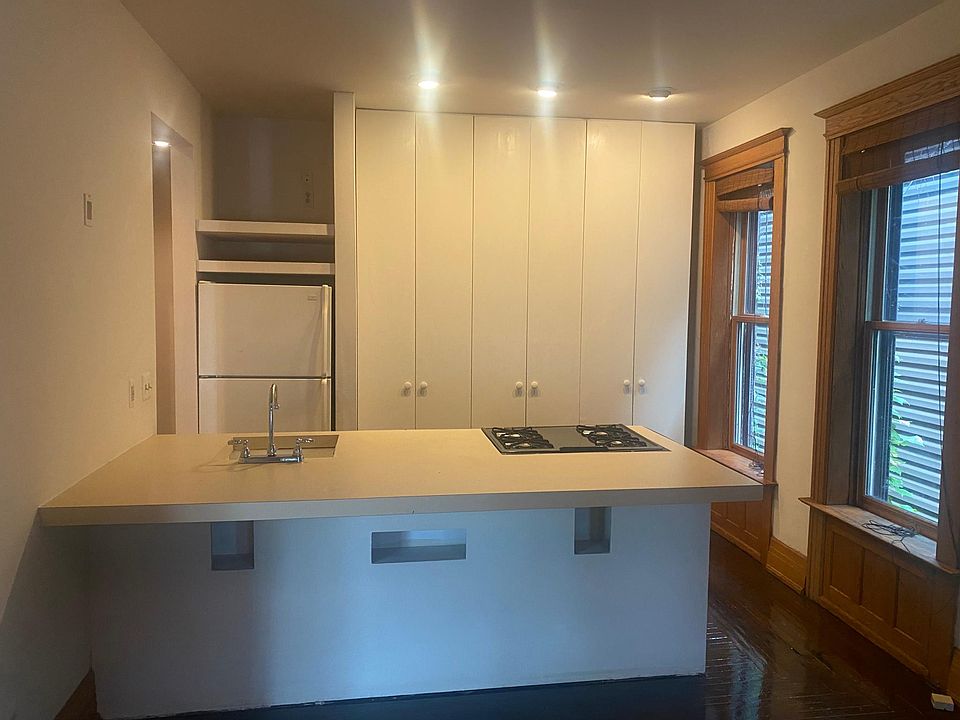 Kitchen including slide in gas stove, refrigerator and dishwasher