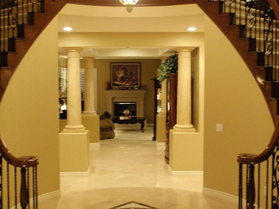 Front Entrance - Dual Iron Rod Staircase - Marble Entry With Medallion