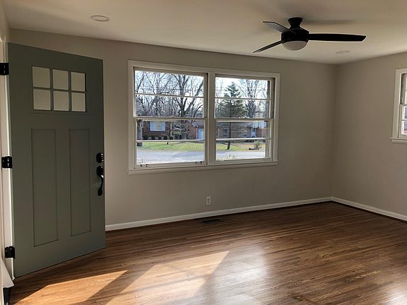 Living Room is light and airy and has hardwood floors and ceiling fan and nice light coming in from 3 windows not including window at the front door