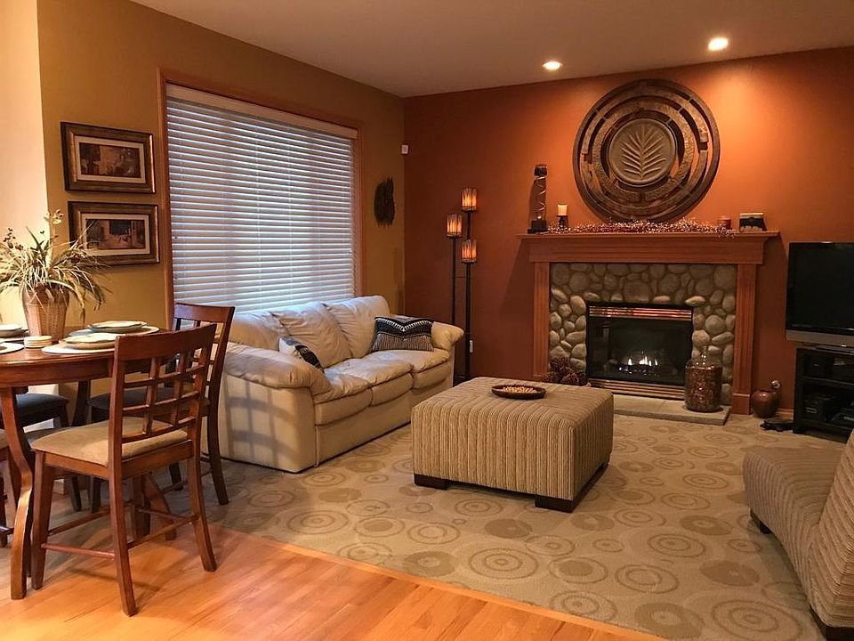 Cozy family room with gas fireplace, wide screen TV and slider leading to deck