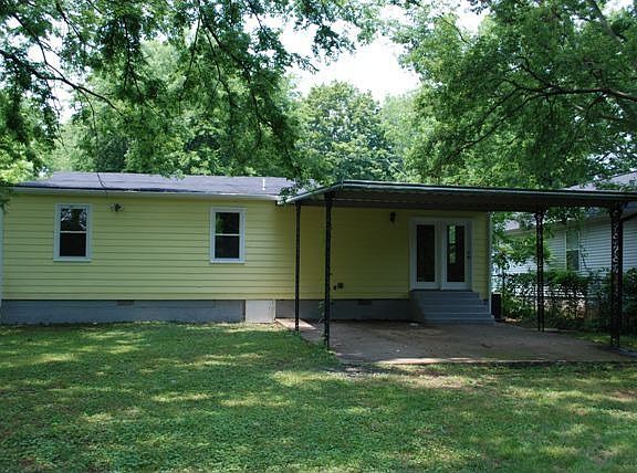 Awesome covered carport could be used for parking or the perfect party spot!