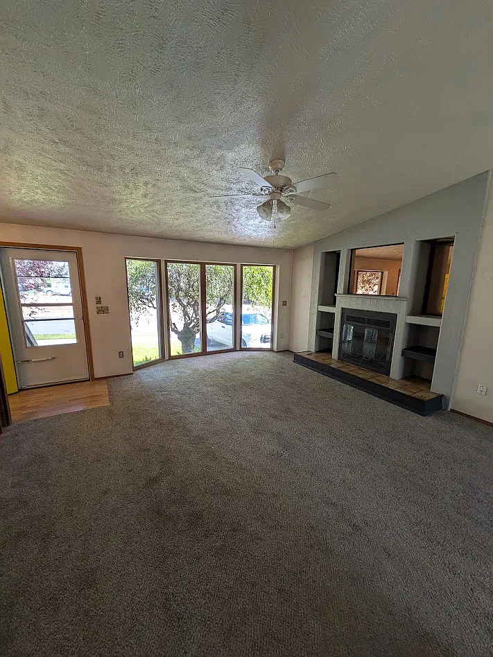 Living room and fireplace - 4214 E 35th Ave