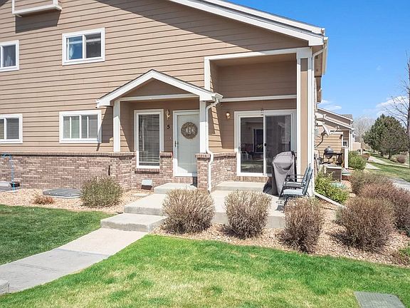 Photo shows entrance to corner unit and sliding glass door off the living room and the patio.