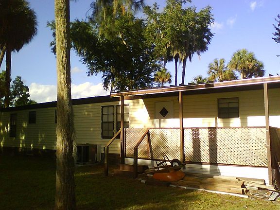 Back view with spa on porch