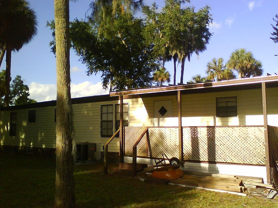 Back view with spa on porch