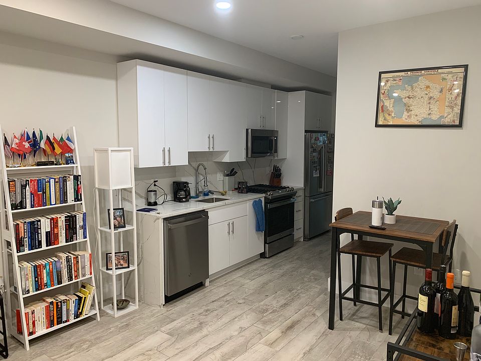 Kitchen/dining area with brand new appliances.