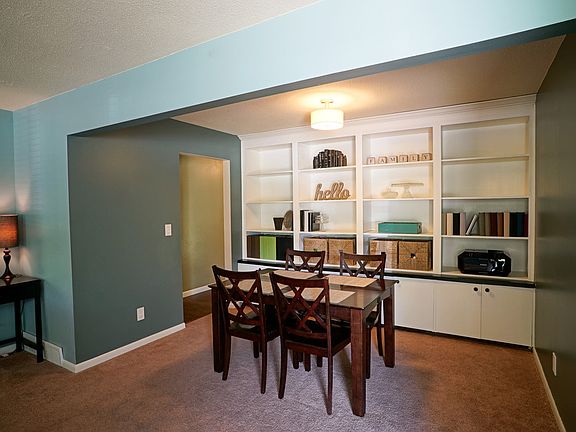 The custom bookshelves with lower level cabinets were added by sellers in 2015