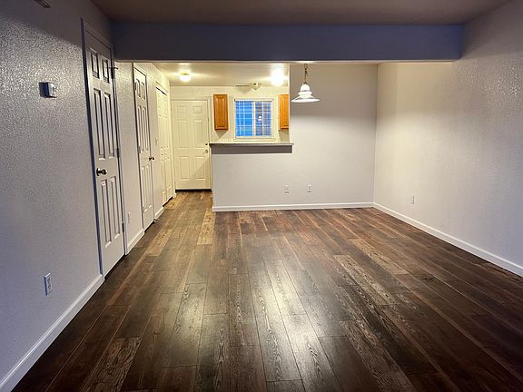 Living and dining room with half bathroom