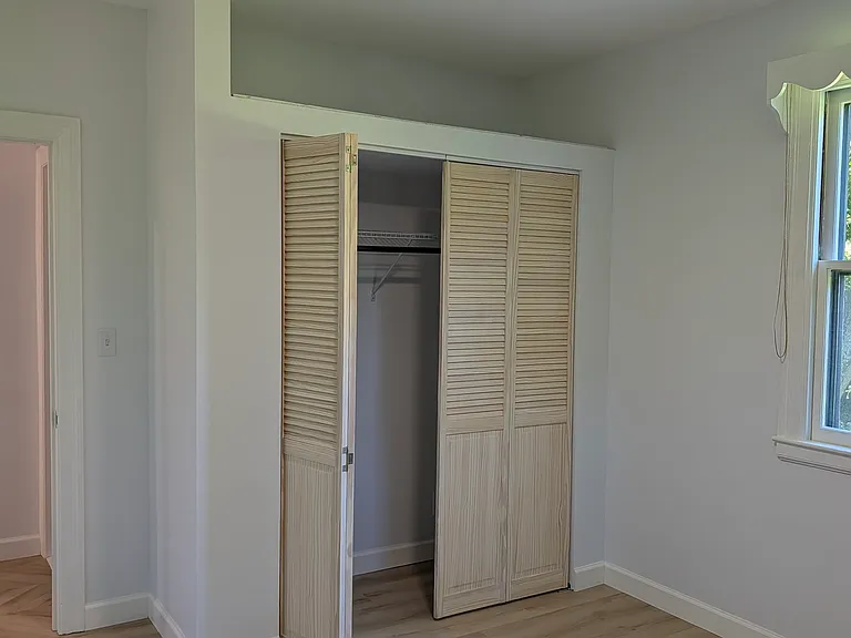 7' closet with open storage for luggage, bins, etc.