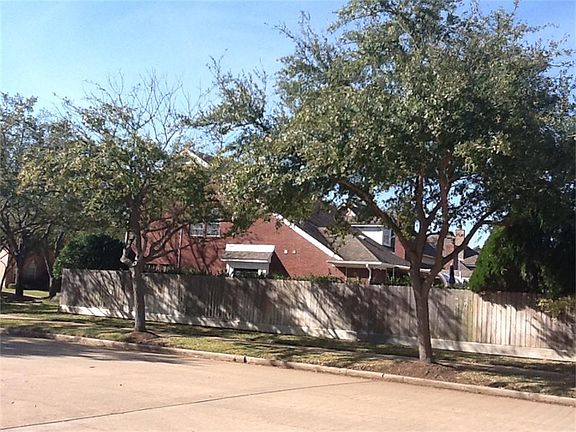 Side elevation showing the corner location and great trees lining the home and down the street!