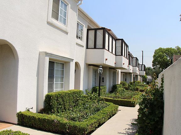 Beautifully landscaped court yard/side yard entries to each townhouse.