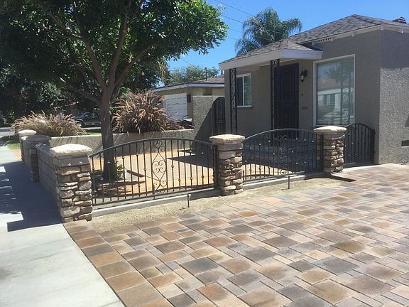 Front entry with patio and tree